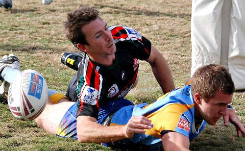 Gympie Devils halfback Nick Swan is hit late after scoring for the home side at the weekend. Swan kicked the winning field goal proving the difference against Nambour. The Devils will play Caloundra this Sunday for the first place in the Caloundra RSL Cup grand final. Gympie Devils halfback Nick Swan is hit late after scoring for the home side at the weekend. Swan kicked the winning field goal proving the difference against Nambour. The Devils will play Caloundra this Sunday for the first place in the Caloundra RSL Cup grand final.